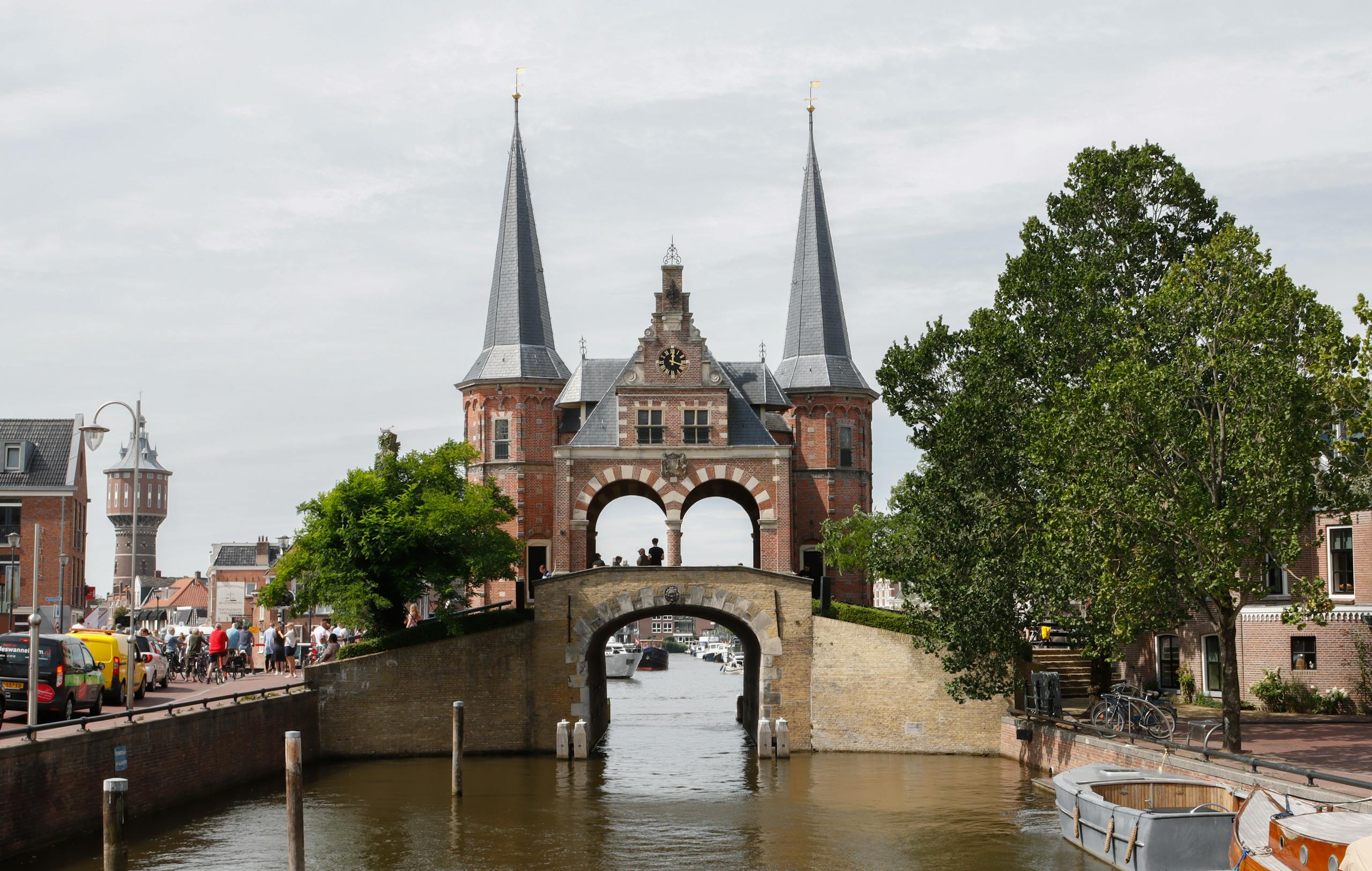 Historic Waterpoort in Sneek, Netherlands, with surrounding canal and architecture.